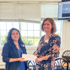 Maria Flores is presented with a Business & Professional Women Scholarship
