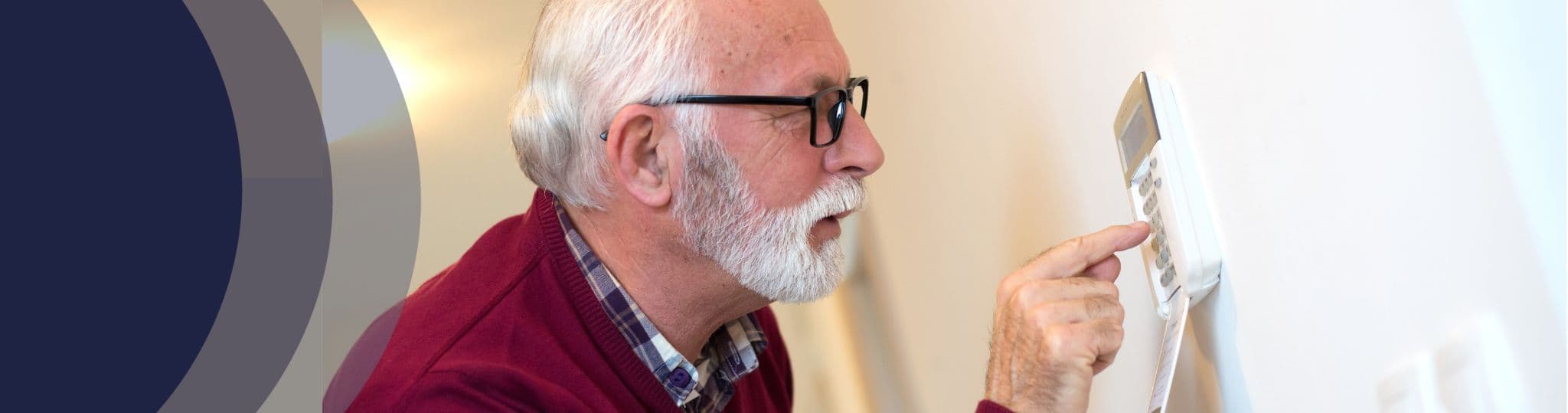elderly man adjusts a digital thermometer