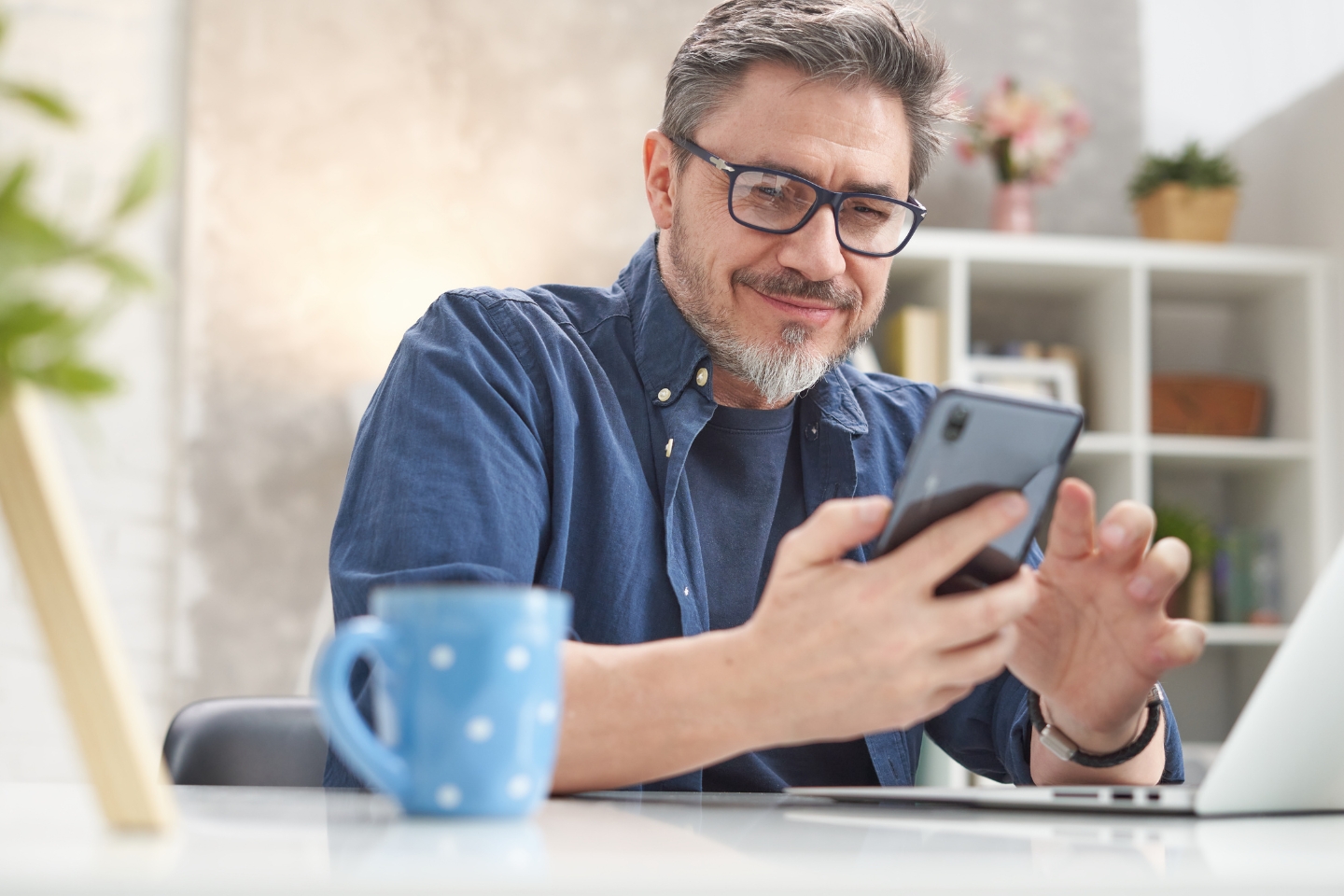 man looking at cell phone