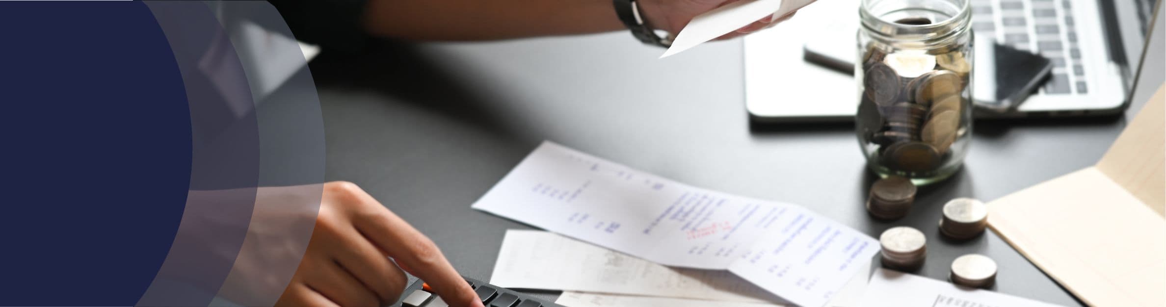 a person tallies receipts 