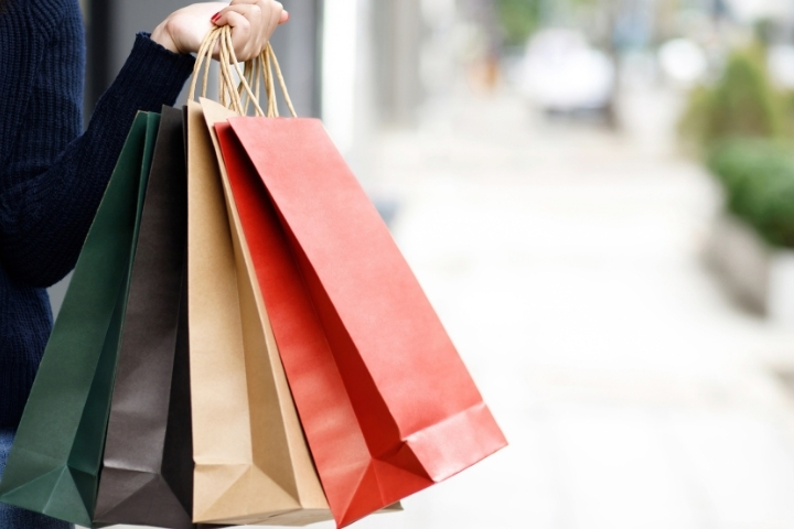 Arm holding shopping bags