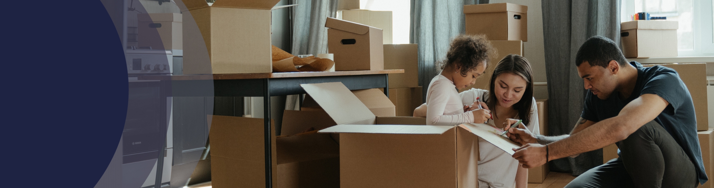 family unpacking boxes
