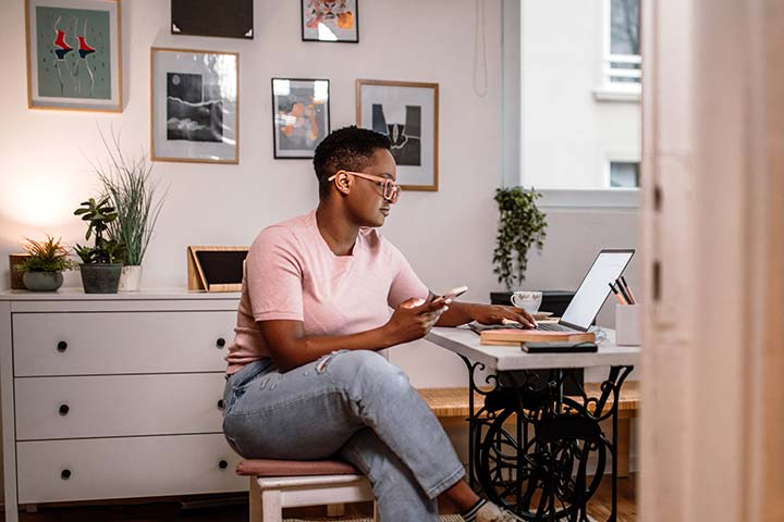 Woman at home using laptop