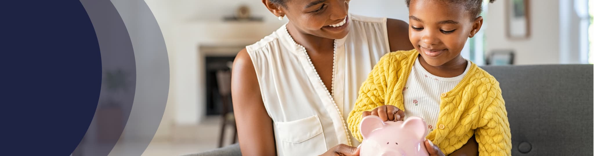 a mother helps her daughter put money in a piggy bank