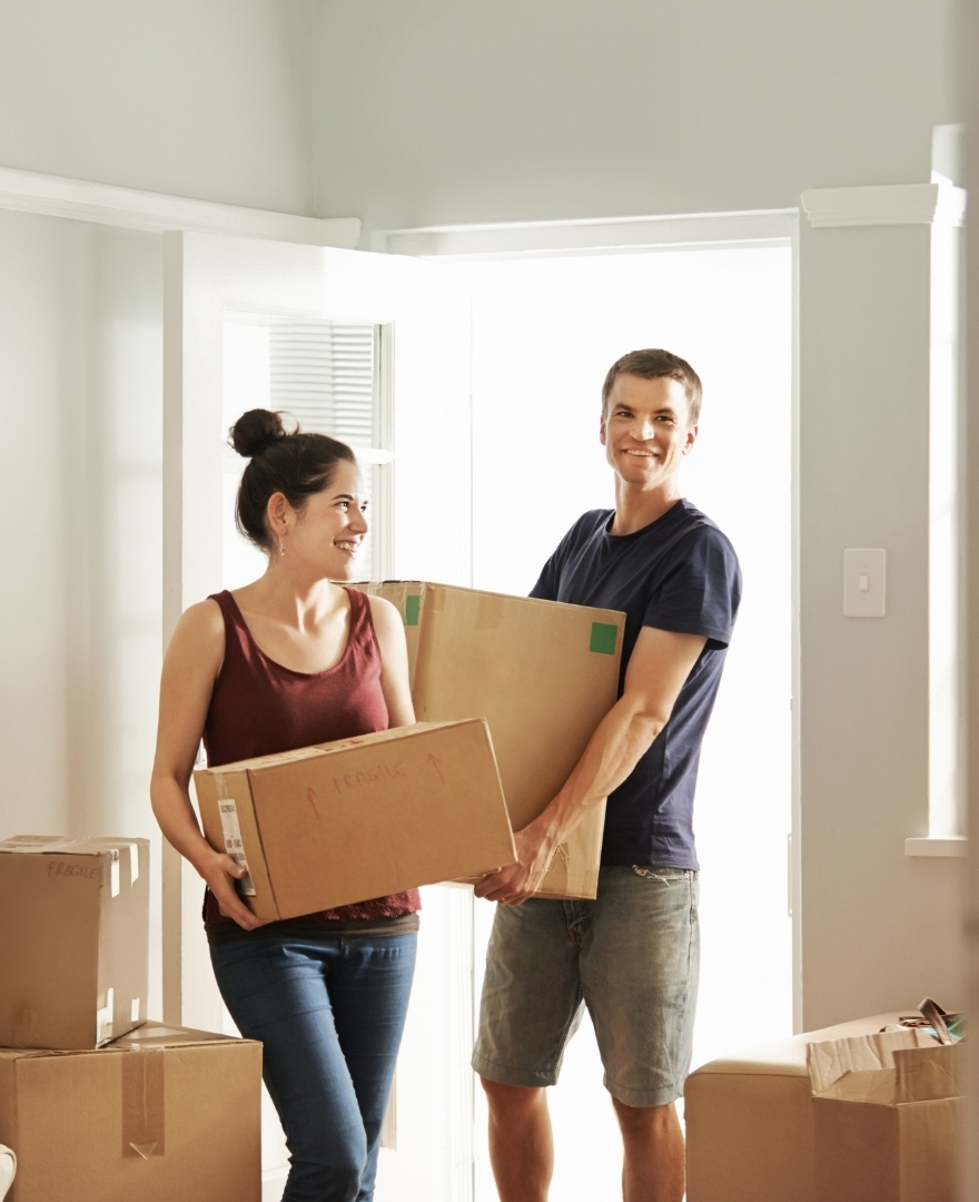 young couple moving into a house