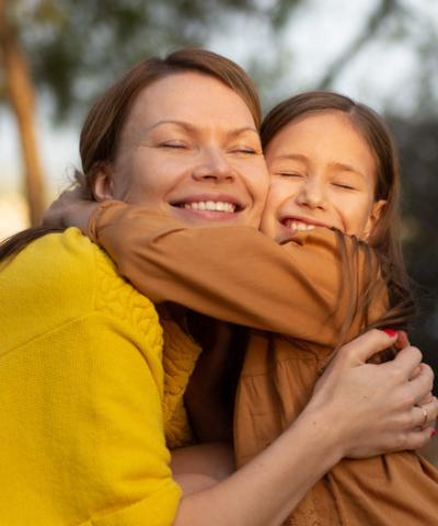 mom and daughter hugging