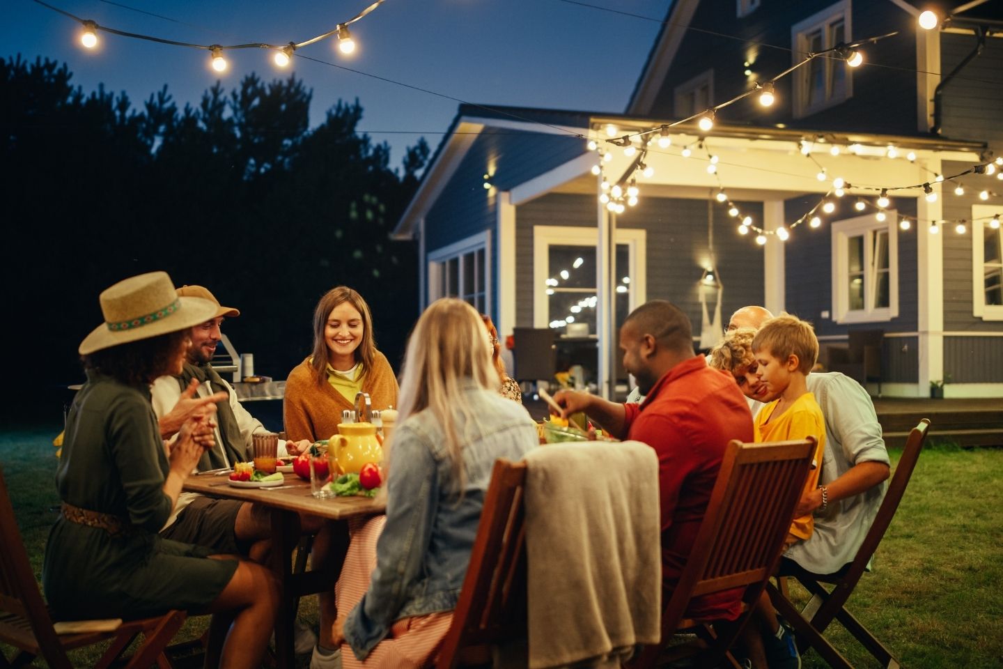 People enjoying a nighttime meal outside