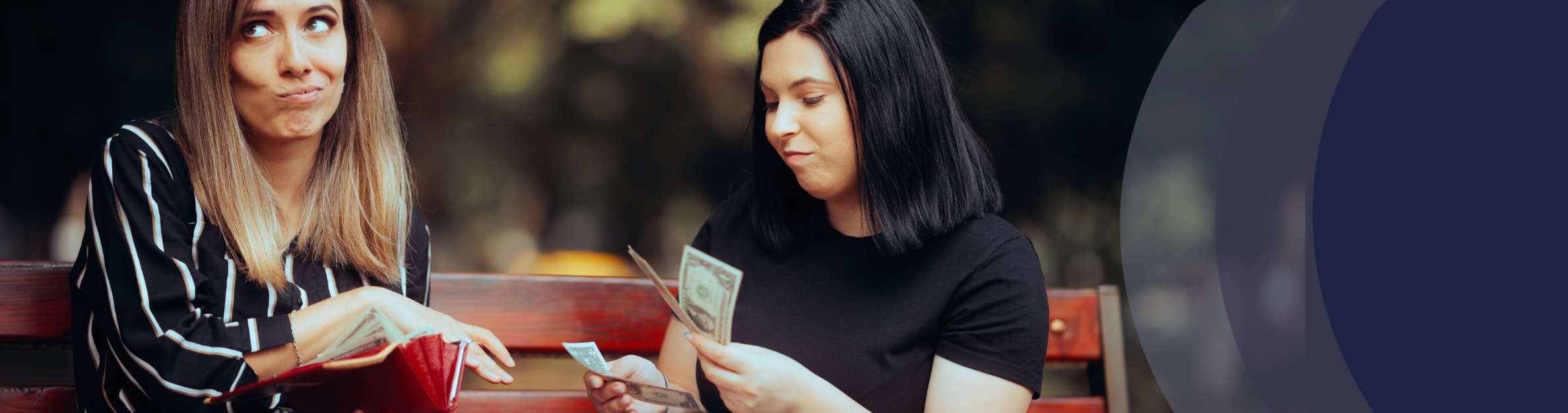 a woman giving another woman cash
